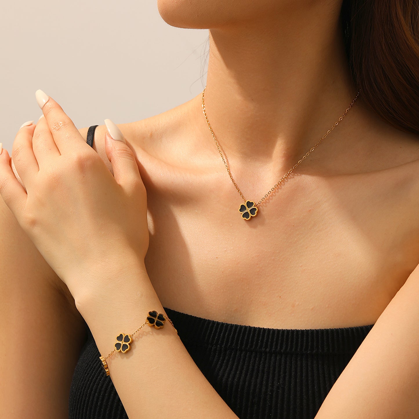Schmuckset Klee Gold Schwarz Armband und Halskette Edelstahl vergoldet wasserfest hypoallergen Karma