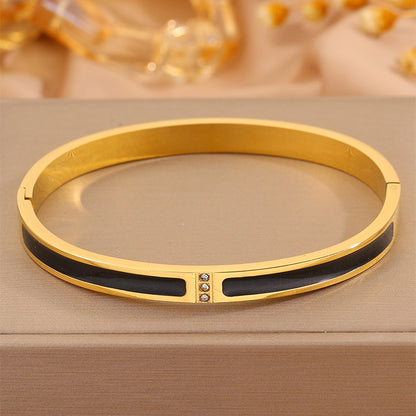 Armreif Gold Schwarz Edelstahl vergoldet Damenarmreif wasserfest hypoallergen Karma